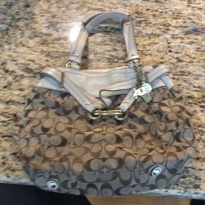 White and beige coach purse